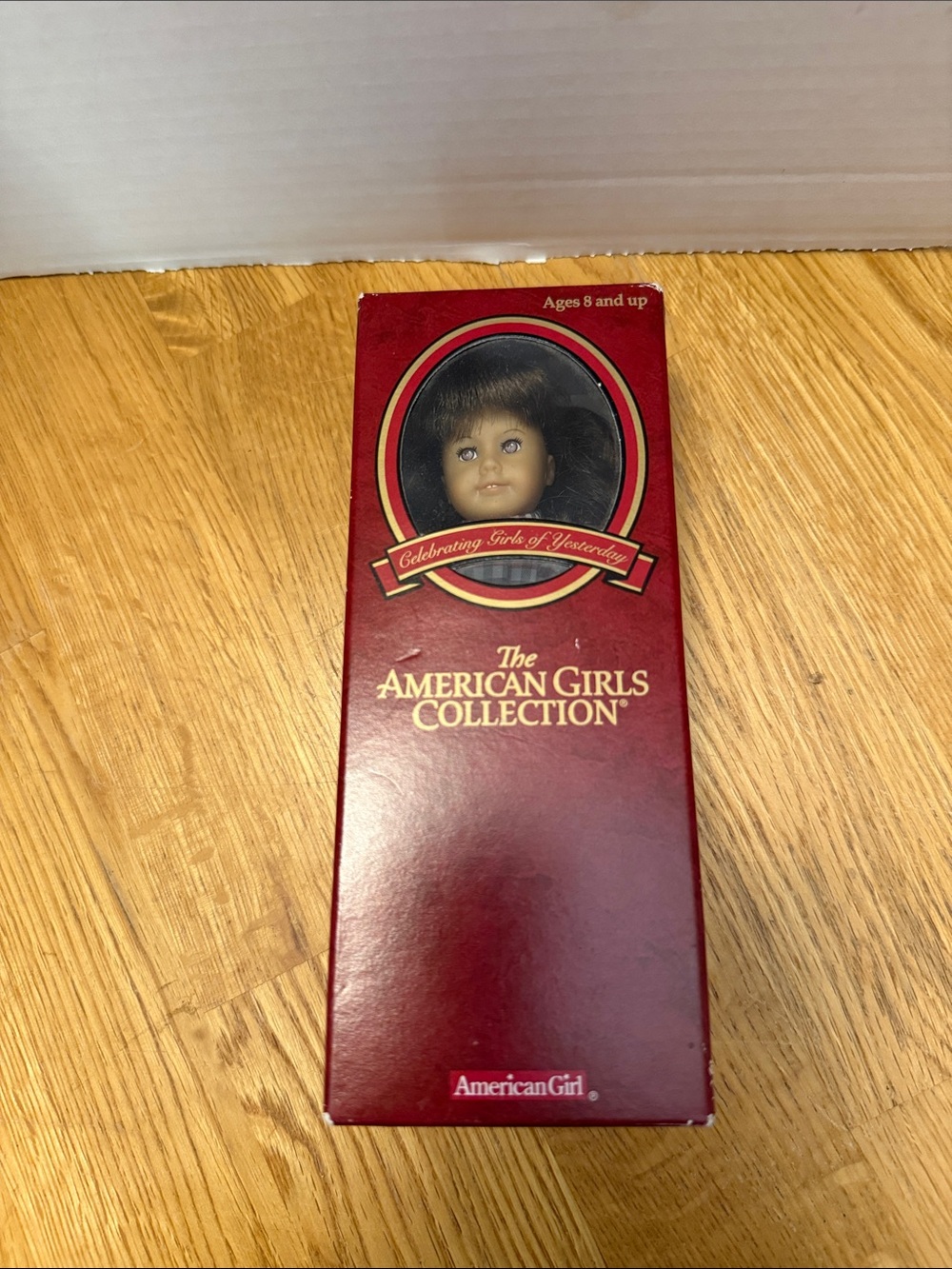Collectible mini American girl doll with book inbox